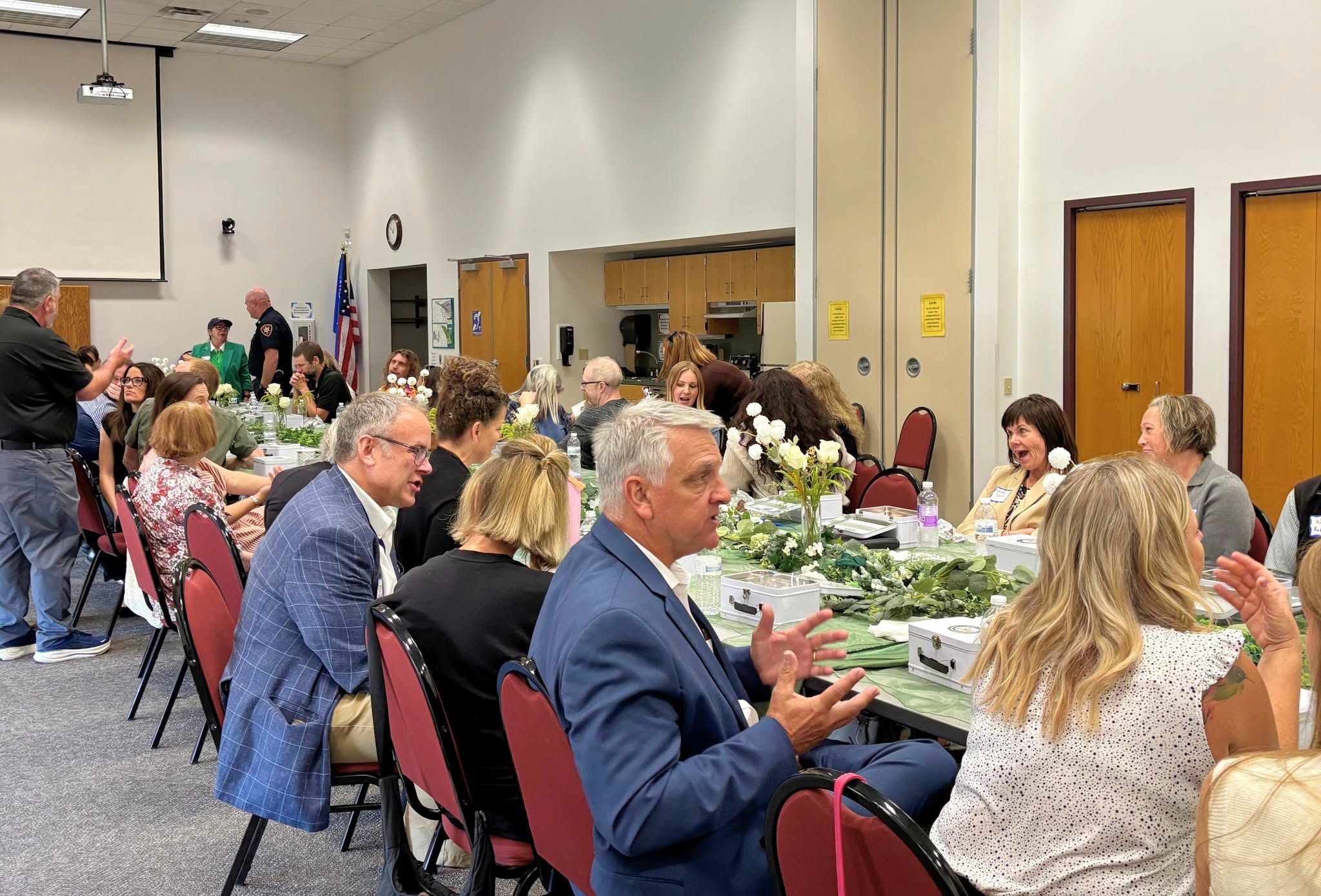 Attendees connecting and having conversations while seated at lunch.
