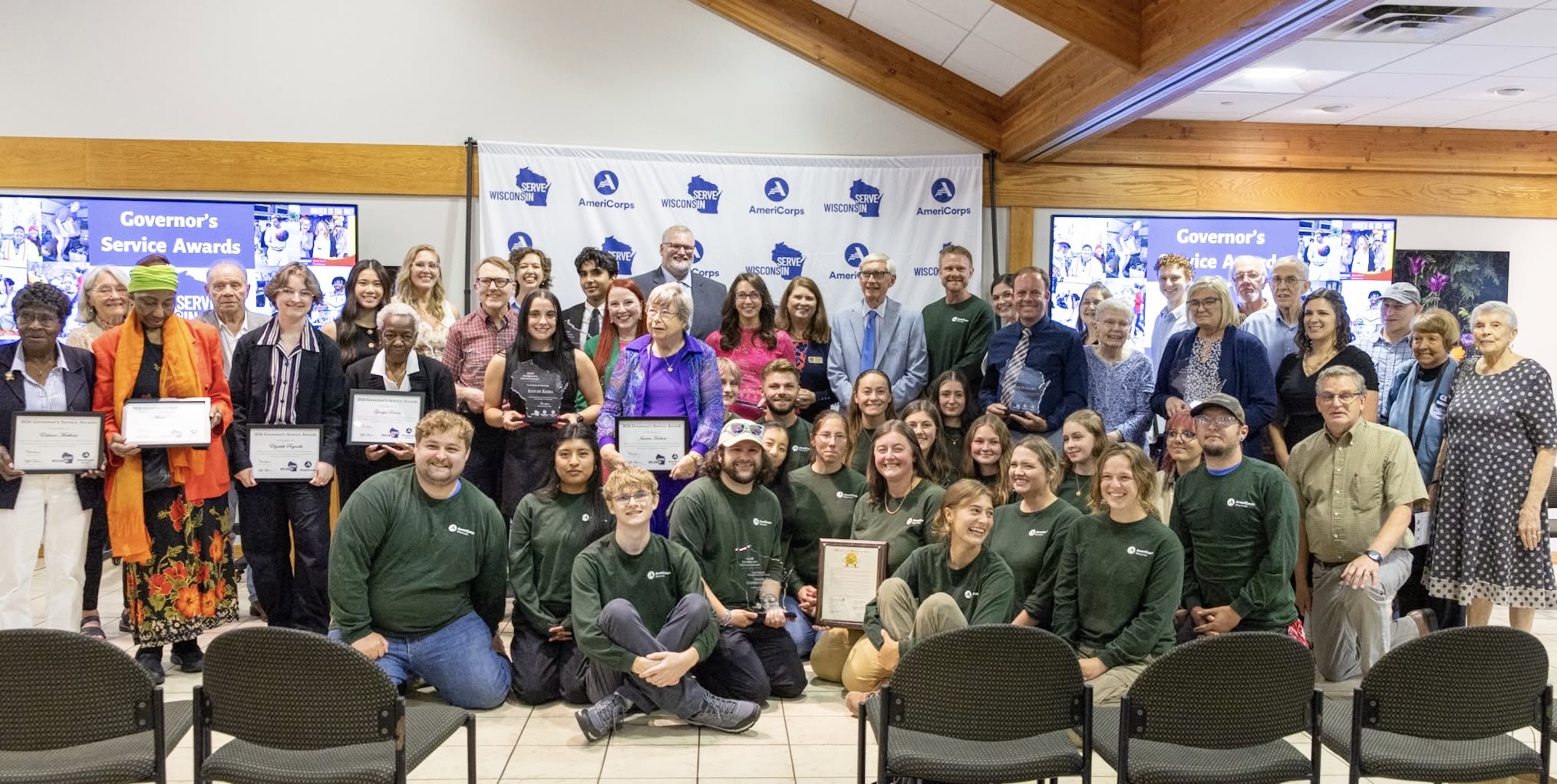 Large group picture of all the 2026 Governor's Service Award recipients, along with Governor Tony Evers and Secretary Kathy Blumenfeld.